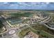 Aerial view of community amenities, including tennis courts and clubhouse at 5517 Palmer Cir # 101, Bradenton, FL 34211