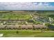 Aerial view of community, showing homes, golf course, and resort amenities at 5517 Palmer Cir # 101, Bradenton, FL 34211