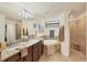 Spa-like bathroom with double vanity and a large soaking tub at 5517 Palmer Cir # 101, Bradenton, FL 34211