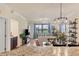 Elegant dining room adjacent to the kitchen with granite countertops at 5517 Palmer Cir # 101, Bradenton, FL 34211