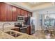 Updated kitchen with stainless steel appliances and granite countertops at 5517 Palmer Cir # 101, Bradenton, FL 34211