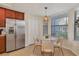 Bright kitchen nook with a round table and four chairs near a window at 5517 Palmer Cir # 101, Bradenton, FL 34211