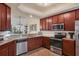 Kitchen features stainless steel appliances and wood cabinets at 5517 Palmer Cir # 101, Bradenton, FL 34211