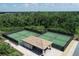 Two pickleball courts with a covered pavilion at 5517 Palmer Cir # 101, Bradenton, FL 34211