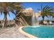 Large rock waterfall feature in the middle of the community pool at 5517 Palmer Cir # 101, Bradenton, FL 34211