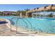 Stunning resort-style pool with waterfall and plenty of lounge chairs at 5517 Palmer Cir # 101, Bradenton, FL 34211