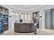 Spa reception area with a modern curved desk and various beauty products at 5517 Palmer Cir # 101, Bradenton, FL 34211