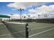 Tennis court with net and lights at 5517 Palmer Cir # 101, Bradenton, FL 34211