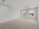 Bright bonus room with neutral decor and carpet flooring at 5564 Coachwood Cv, Bradenton, FL 34211