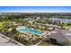 Aerial view of community pool and clubhouse at 5564 Coachwood Cv, Bradenton, FL 34211