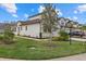 Two-story house with light-colored exterior, brown roof, and landscaping at 5564 Coachwood Cv, Bradenton, FL 34211