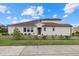 Two-story home with brown roof and landscaping at 5564 Coachwood Cv, Bradenton, FL 34211