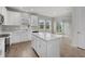 Modern kitchen featuring white cabinets and an island at 5564 Coachwood Cv, Bradenton, FL 34211