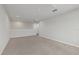 Spacious loft area with carpeted floors and great natural light at 5564 Coachwood Cv, Bradenton, FL 34211