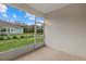 Screened-in porch with view of backyard and pond at 5564 Coachwood Cv, Bradenton, FL 34211