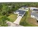 Aerial view of a single-Gathering home with a driveway at 5595 Delight Ave, North Port, FL 34288