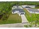 Aerial view of a single-Gathering home with a driveway at 5595 Delight Ave, North Port, FL 34288