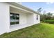 Covered back patio with sliding glass doors at 5595 Delight Ave, North Port, FL 34288