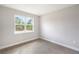 Bedroom with large window and tile floor at 5595 Delight Ave, North Port, FL 34288