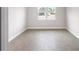 Empty bedroom with tile floors and a window at 5595 Delight Ave, North Port, FL 34288