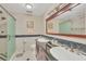 Elegant bathroom with granite countertops and a large walk-in shower at 5625 Pipers Waite # 9, Sarasota, FL 34235