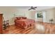 Spacious bedroom with hardwood floors and a king-size bed at 5625 Pipers Waite # 9, Sarasota, FL 34235