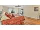 Spacious bedroom with hardwood floors and access to a private patio at 5625 Pipers Waite # 9, Sarasota, FL 34235