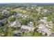 Aerial view of community with pool, golf course, and ocean views at 5625 Pipers Waite # 9, Sarasota, FL 34235