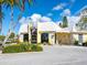 Community clubhouse with welcoming entryway and ample parking at 5826 Driftwood Pl # 34, Sarasota, FL 34231