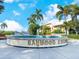 Charming fountain in Baywood Colony with palm trees and benches at 5826 Driftwood Pl # 34, Sarasota, FL 34231