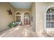 Inviting front porch with double doors and a brick patio at 5826 Driftwood Pl # 34, Sarasota, FL 34231