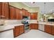 Spacious kitchen with wood cabinets and stainless steel appliances at 5826 Driftwood Pl # 34, Sarasota, FL 34231