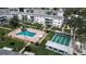 Aerial view showing apartment community pool and shuffleboard at 5928 Welcome Rd # H4, Bradenton, FL 34207