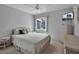 Cozy bedroom with a queen-size bed and wicker furniture at 5928 Welcome Rd # H4, Bradenton, FL 34207