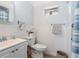 Clean bathroom with white tile, a toilet, and a vanity at 5936 Driftwood Ave # 16, Sarasota, FL 34231