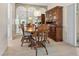 Dining room with wooden table and hutch; hardwood floors at 5936 Driftwood Ave # 16, Sarasota, FL 34231