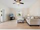 Living room with light flooring, comfortable seating, and TV at 5936 Driftwood Ave # 16, Sarasota, FL 34231