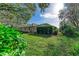 Landscaped backyard with lush greenery at 601 Lakescene Dr, Venice, FL 34293