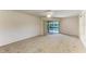 Bedroom with sliding doors opening to a view of the pool at 601 Lakescene Dr, Venice, FL 34293