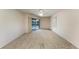 Bedroom with sliding doors to pool view and ceiling fan at 601 Lakescene Dr, Venice, FL 34293