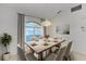 Dining room with large arched window and chandelier at 601 Lakescene Dr, Venice, FL 34293