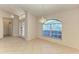 Dining area with an arched window and tile flooring at 601 Lakescene Dr, Venice, FL 34293