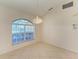 Dining area with an arched window and tile flooring at 601 Lakescene Dr, Venice, FL 34293