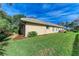 Tan house exterior with well-maintained lawn at 601 Lakescene Dr, Venice, FL 34293