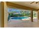 Inviting pool area with screened enclosure and patio at 601 Lakescene Dr, Venice, FL 34293