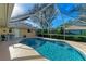 Enjoy this refreshing pool with screened enclosure at 601 Lakescene Dr, Venice, FL 34293