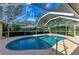 Enjoy this refreshing pool with screened enclosure at 601 Lakescene Dr, Venice, FL 34293