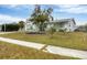 Charming single story home with a well-manicured lawn at 6045 Slade Rd, North Port, FL 34287