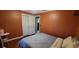 Cozy bedroom with double bed and wood floors at 616 Pawn Way, Seffner, FL 33584