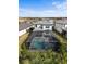 Aerial view of house with pool and cabana at 6299 Crested Eagle Ln, Nokomis, FL 34275